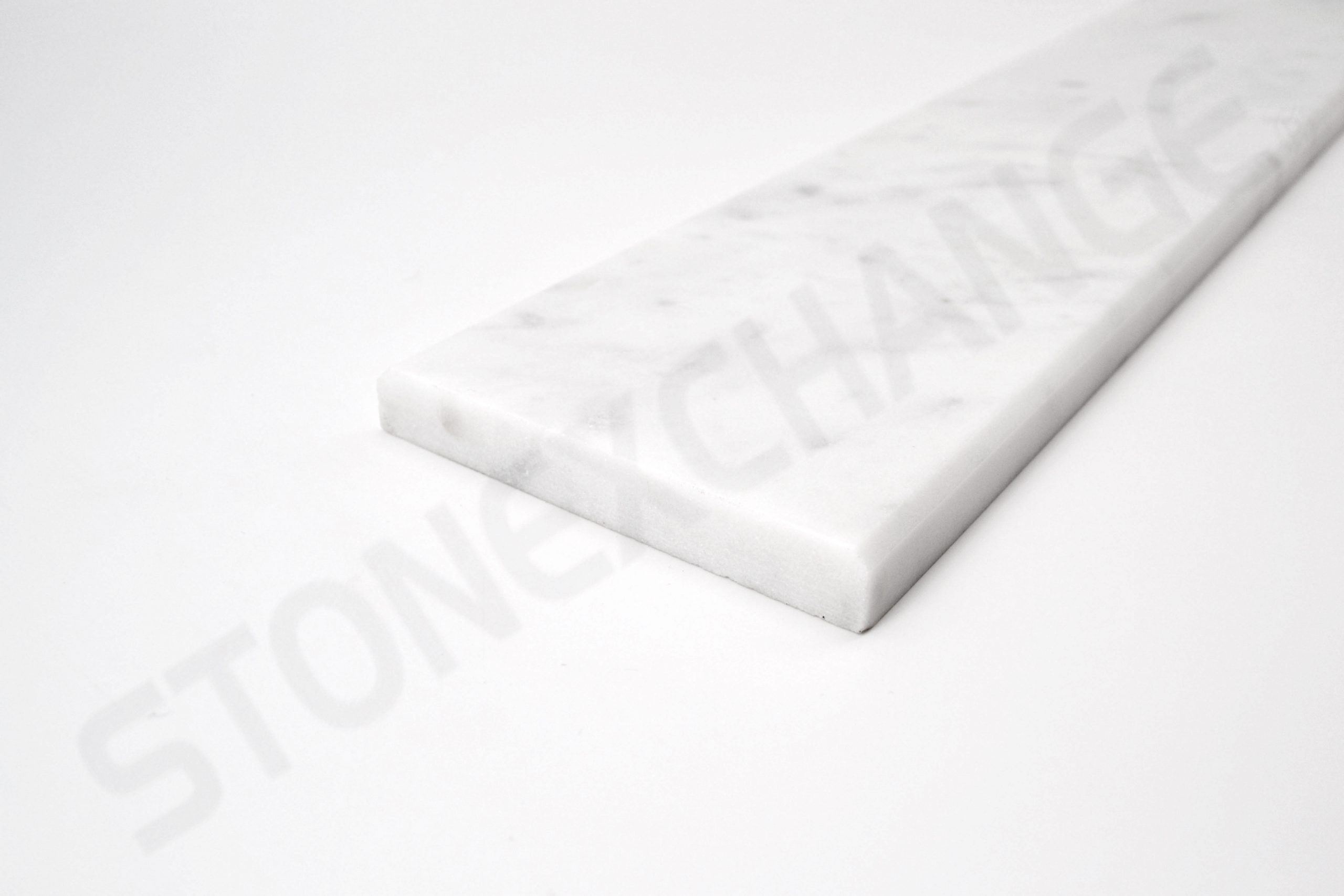 White Carrara Standard Double Bevel Threshold 4x36 Close up